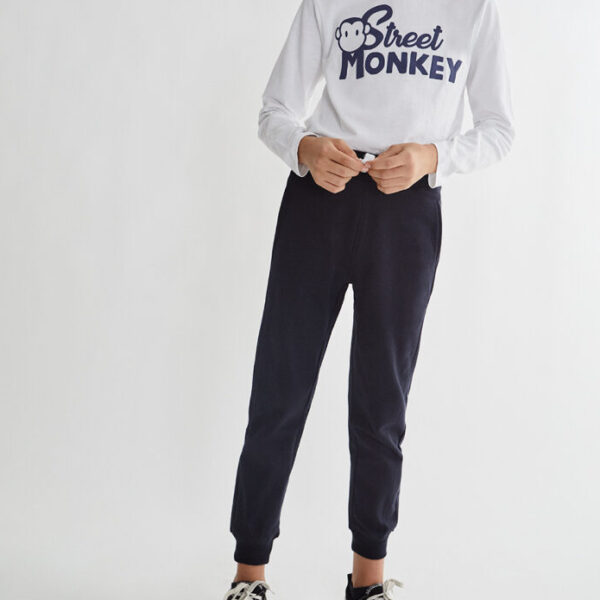 Pantalón felpa perchada con cinturilla elástica y cordones ajustables frontal, bolsillos delanteros y bajo acabado en puño