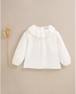 Blusa de bebé muselina blanca con volante en el cuello